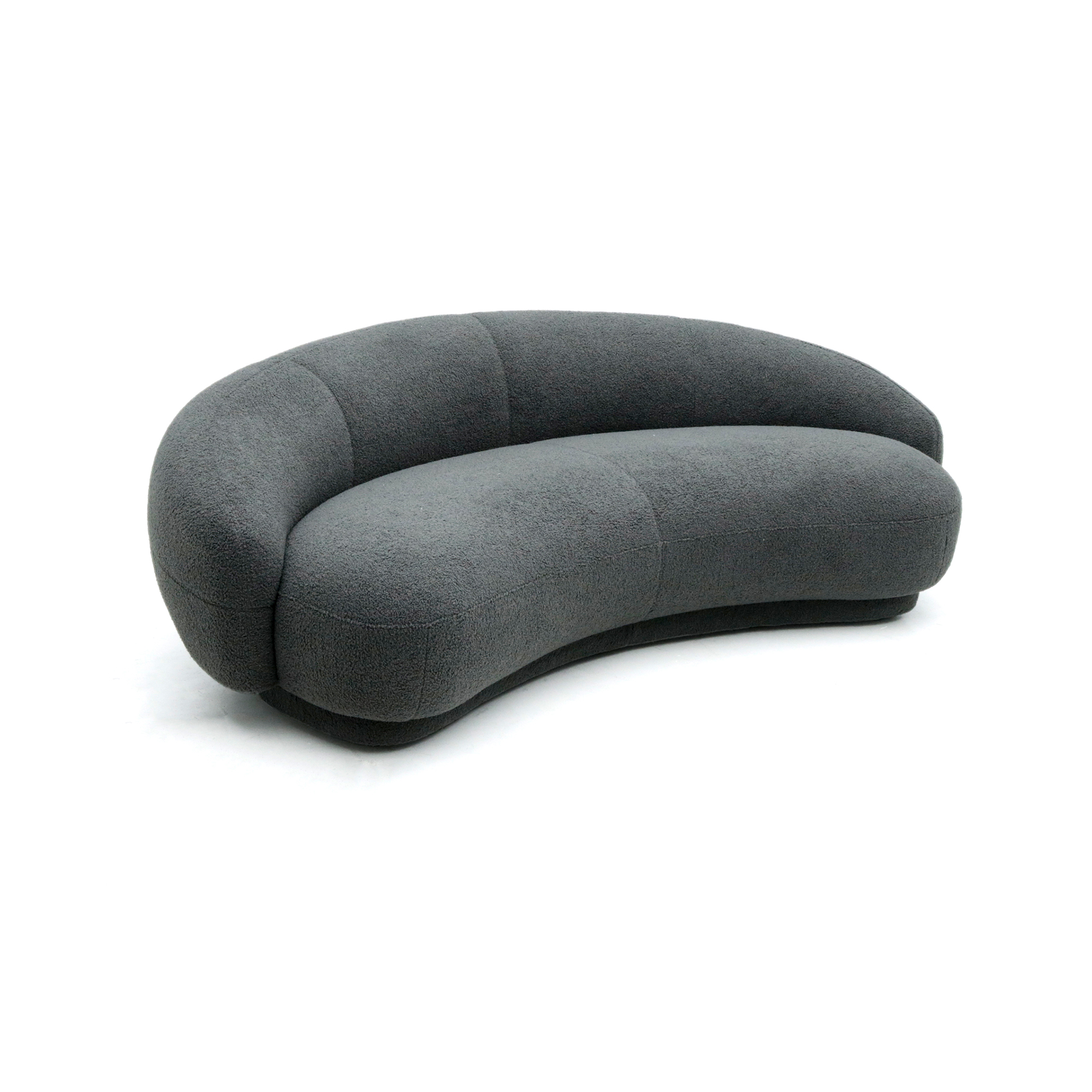 Julep Sofa with rounded backrest, sculptural curves, and soft fabric upholstery in modern minimalist style.