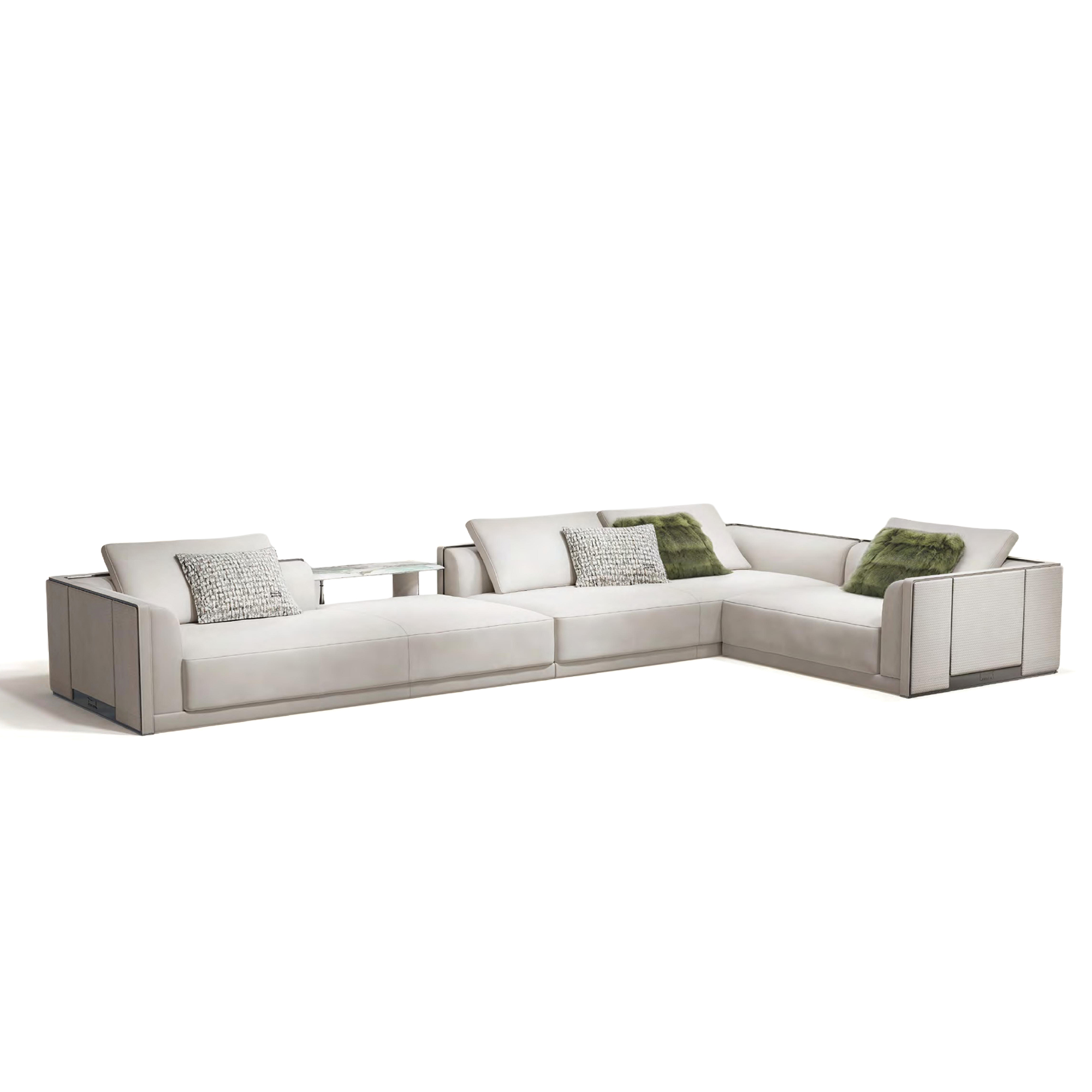 L-shaped white leather sofa with built-in marble shelf and clean lines