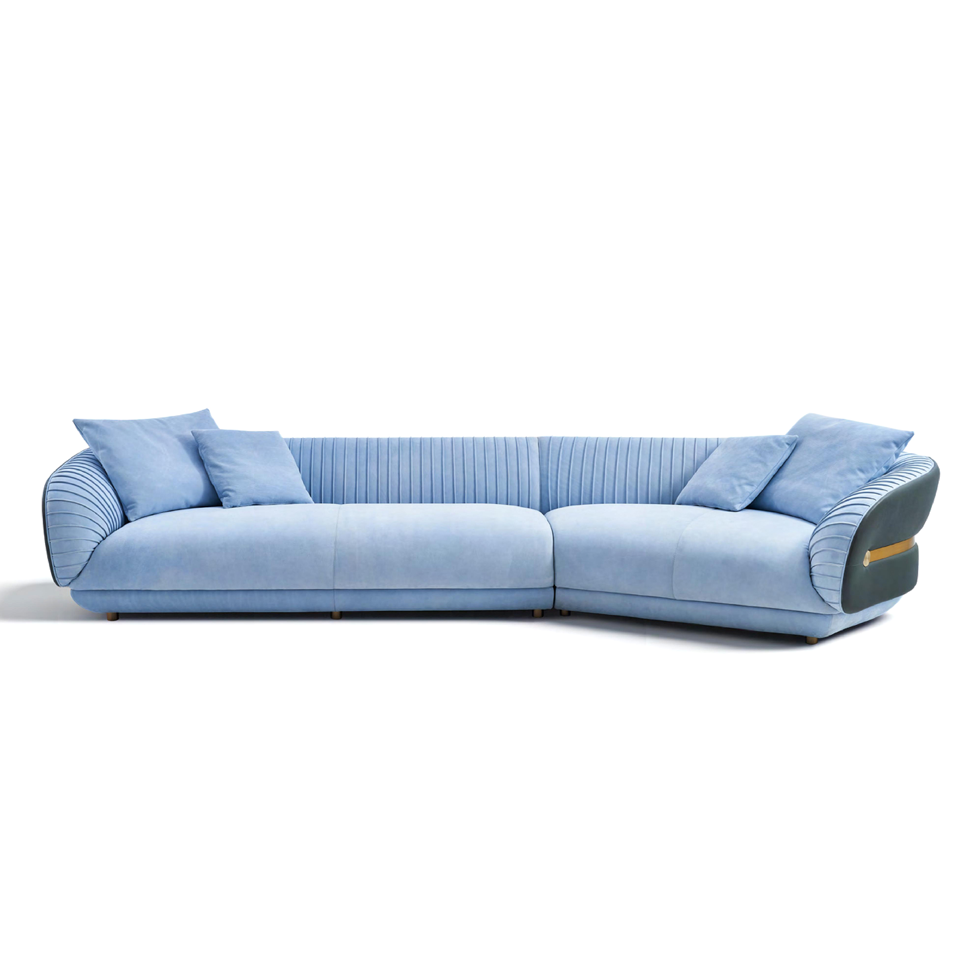 Luxury velvet sofa in soft blue tones with accordion-pleated details
