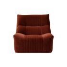 front view of Aralia chair with sculptural curved back and low-profile seat in velvet fabric