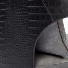 detail show of crocodile embossed leather on a luxury dining chair