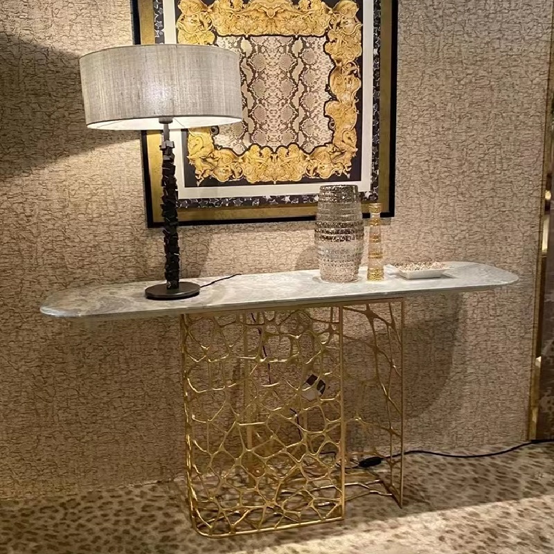 Real shot of the Sioraf console's intricate brass base revealing the hand-chiseled giraffe pattern latticework, highlighting the exceptional artisanal metalwork and the organic flow of the design that characterizes Roberto Cavalli's signature aesthetic.