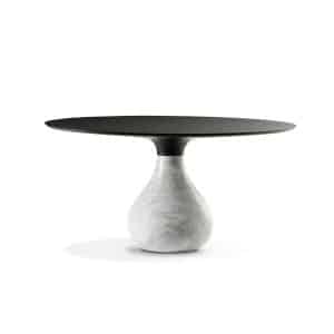Aura Dining Table by European-style with marble droplet base and black marble top in modern sculptural design.
