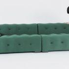Blogger Sofa with tufted green or grey upholstery and modern design.