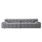Blogger Sofa with tufted grey upholstery and modern design.