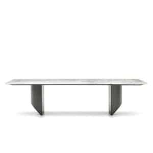 Wedge Dining Table with natural marble top and sculptural metal legs in modern floating design.
