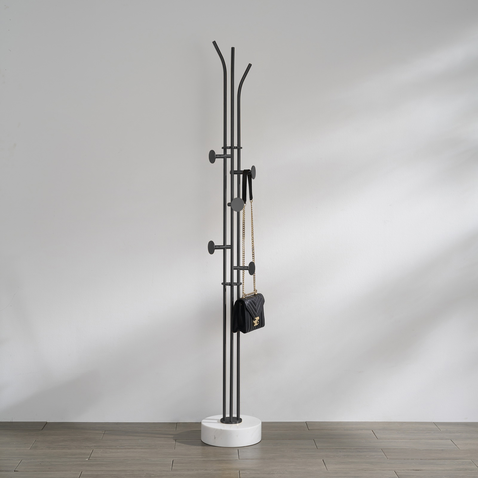 Stainless steel coat rack stand with white natural marble base and multiple brushed adjustable hooks