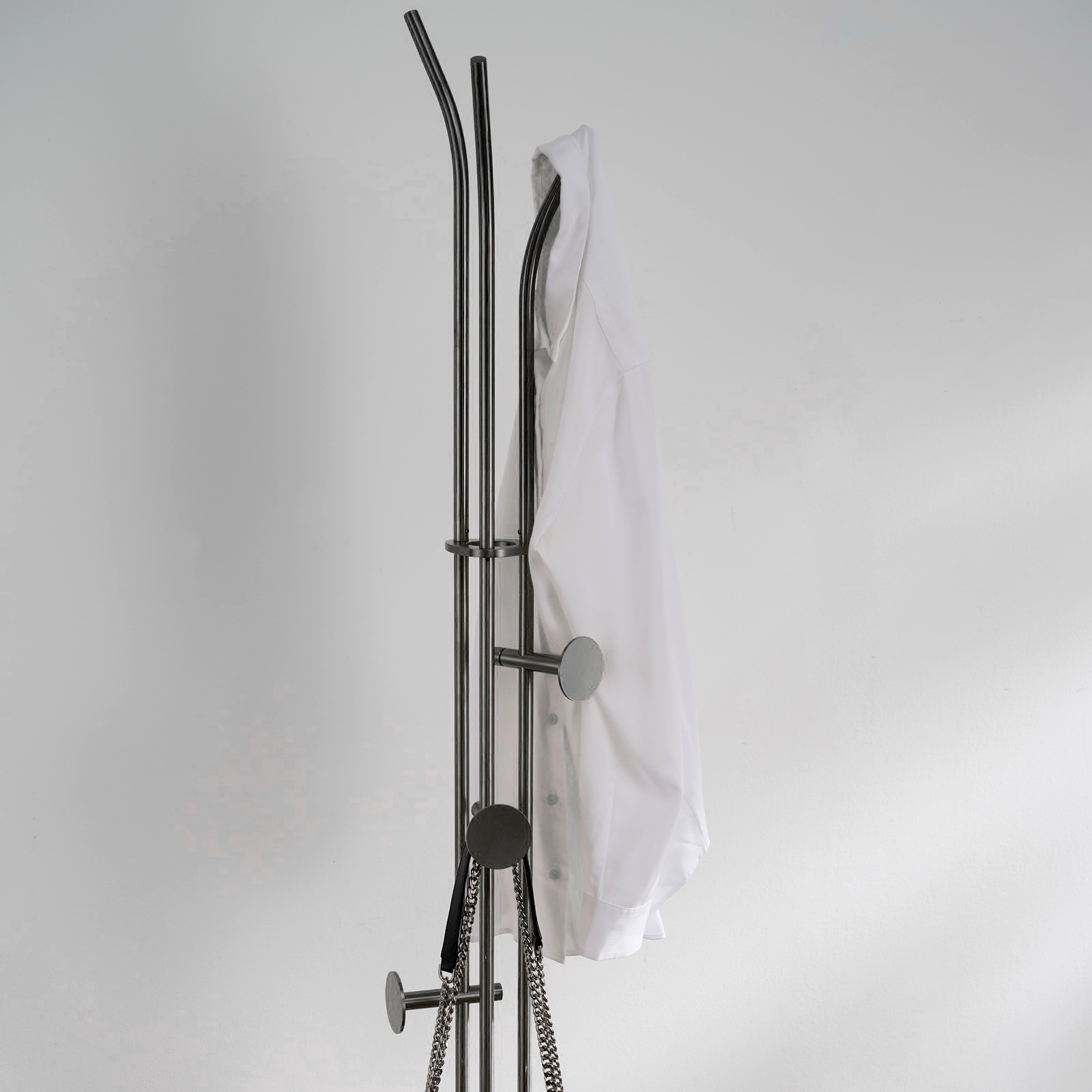 Stainless steel coat rack stand with white natural marble base and multiple brushed adjustable hooks