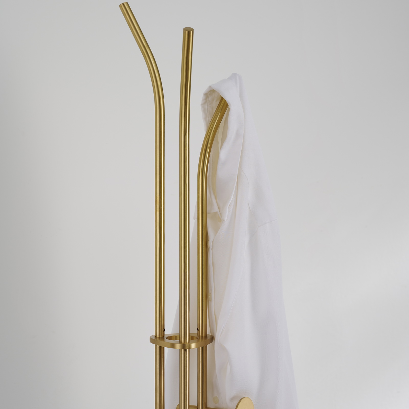 Stainless steel coat rack stand with black marble base and brushed gold-tone adjustable hooks