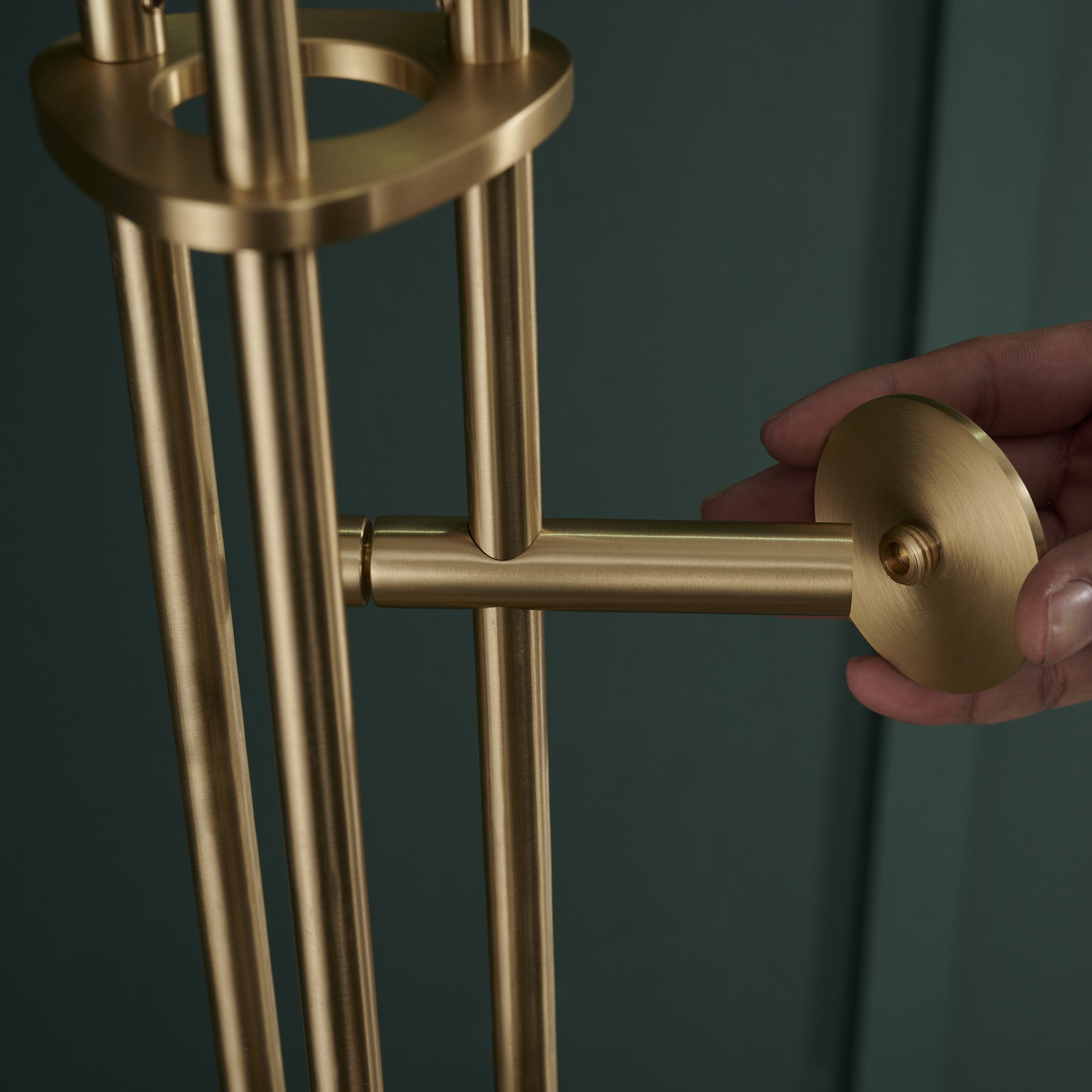 Stainless steel coat rack stand with black marble base and brushed gold-tone adjustable hooks