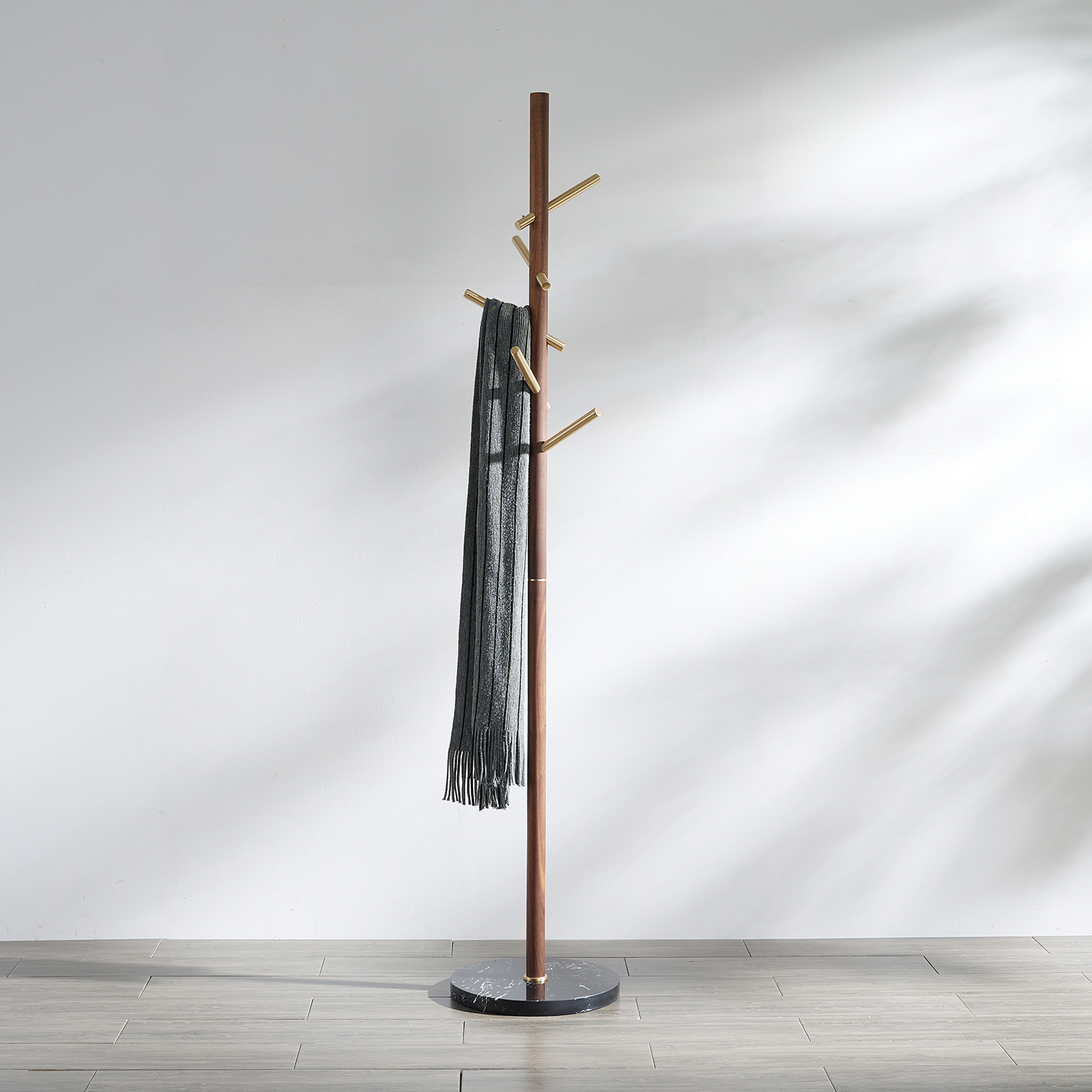 Premium solid brass coat rack stand with black marble base and staggered brushed brass hooks