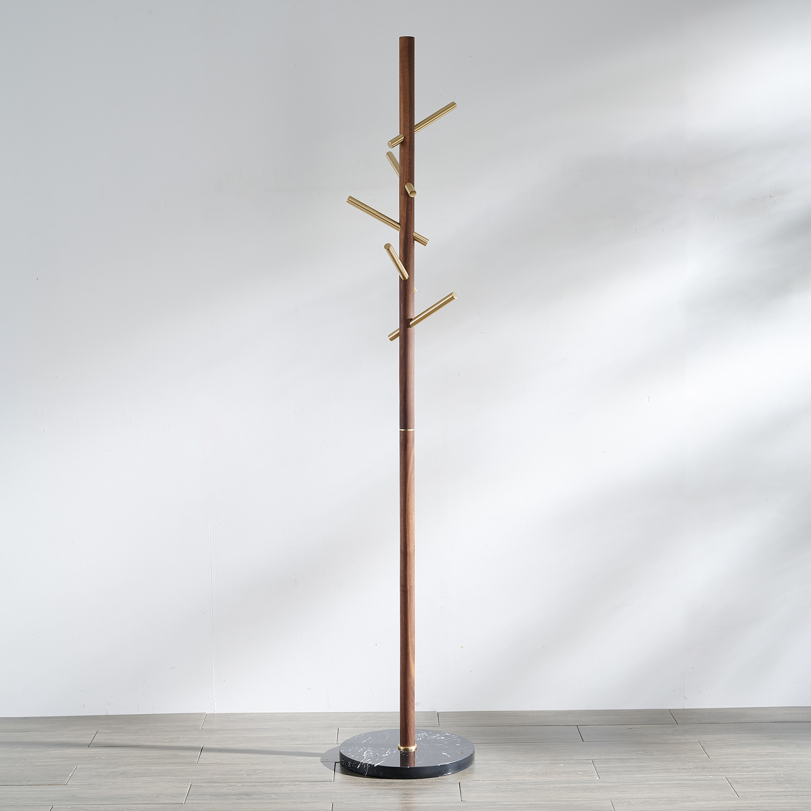 Premium solid brass coat rack stand with black marble base and staggered brushed brass hooks