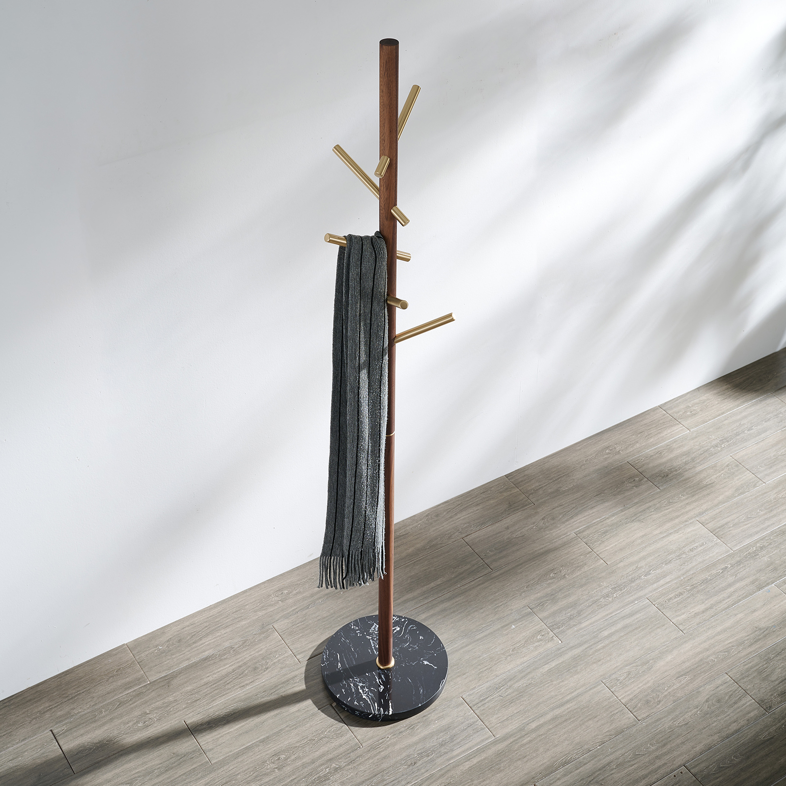 Premium solid brass coat rack stand with black marble base and staggered brushed brass hooks