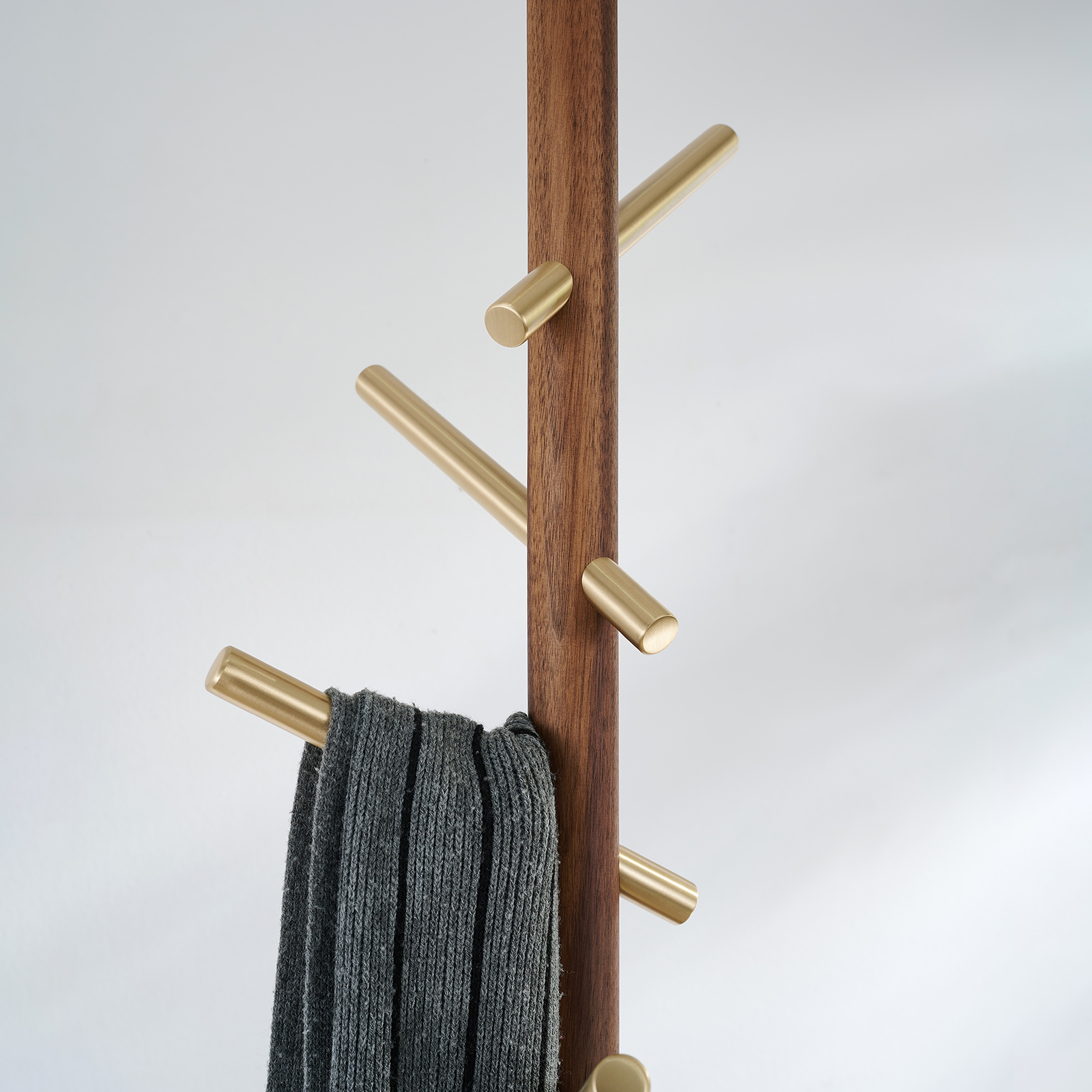 Premium solid brass coat rack stand with black marble base and staggered brushed brass hooks