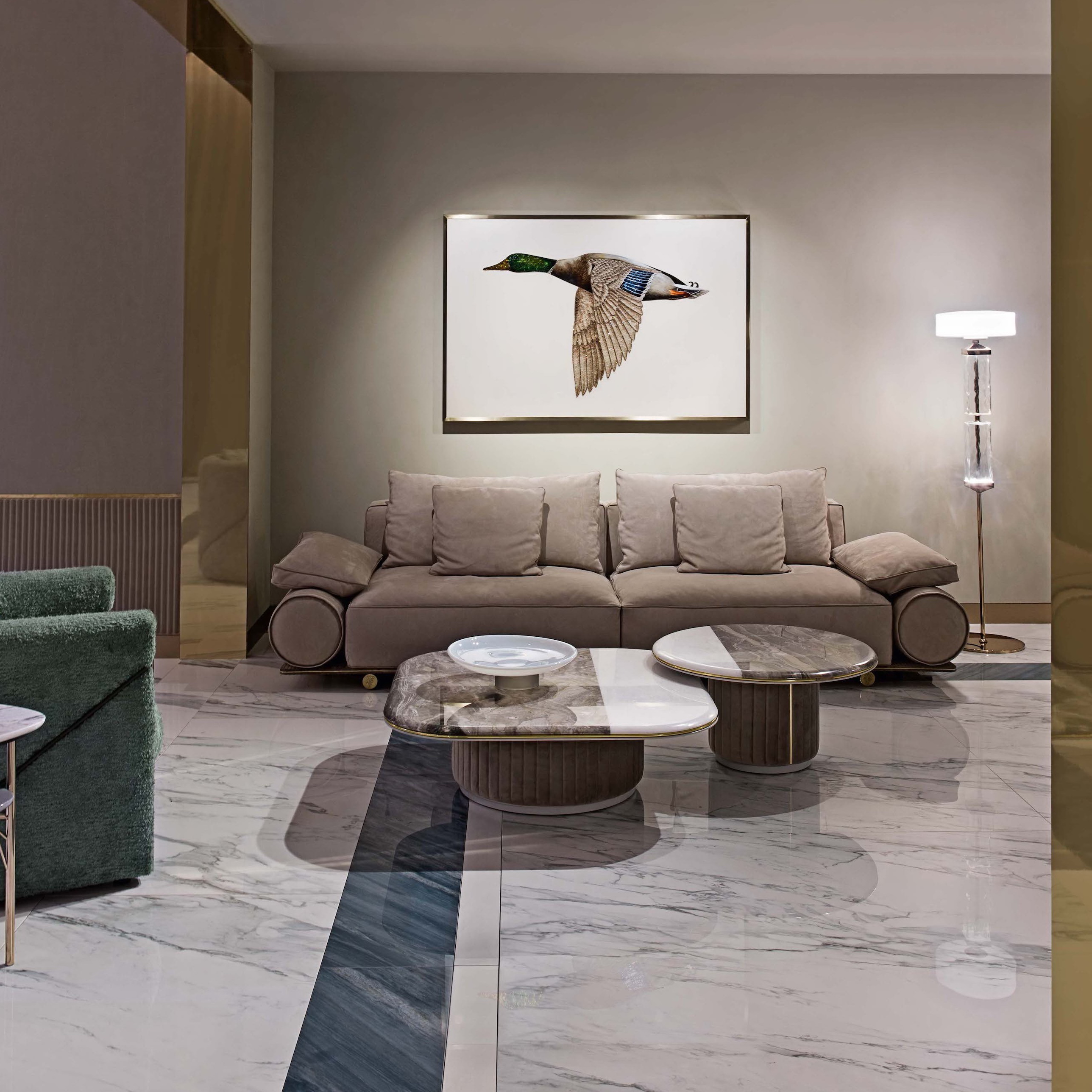 Round marble coffee table with a Prada Green and Arabescato mixed stone top.