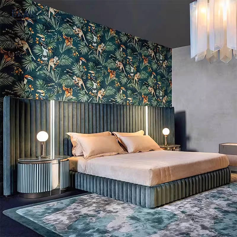 Grand luxury wingback platform bed with teal vertical tufted headboard and champagne gold trim.