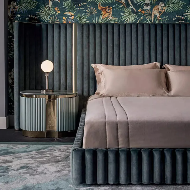 Grand luxury wingback platform bed with teal vertical tufted headboard and champagne gold trim.