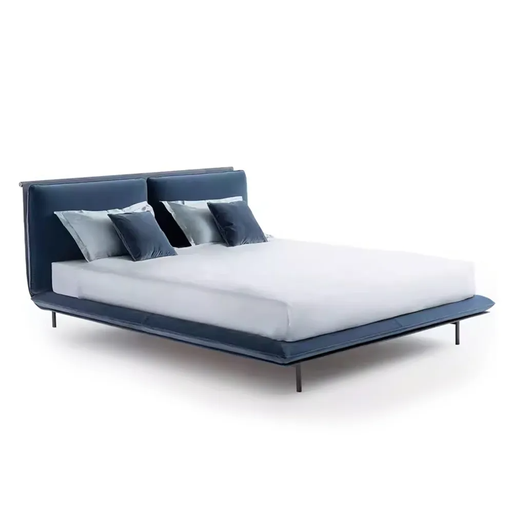 Contemporary fabric upholstered bed frame with polished stainless steel tapered legs.