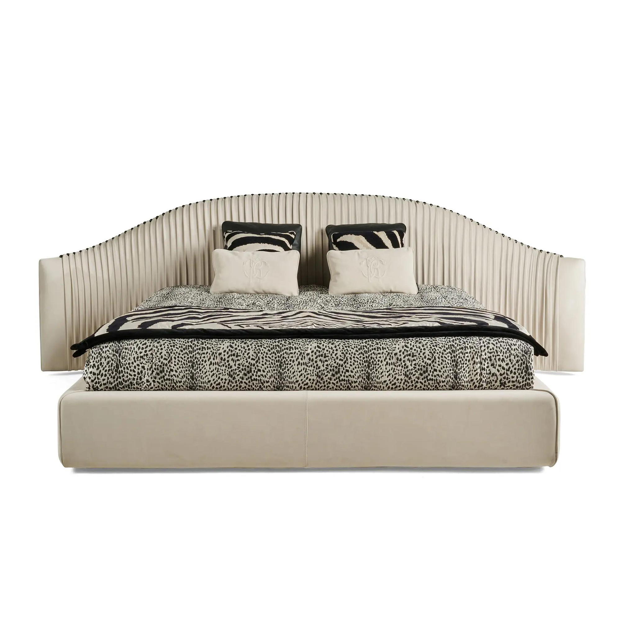 Luxury pleated velvet bed with soft cascading ruching effect and black titanium legs.