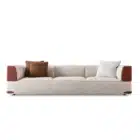 Aveline modular sofa with fabric upholstery and saddle leather armrests