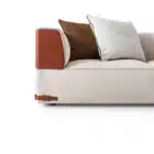 Aveline modular sofa with fabric upholstery and saddle leather armrests