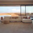 Aveline modular sofa with fabric upholstery and saddle leather armrests