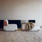 Aveline modular sofa with fabric upholstery and saddle leather armrests