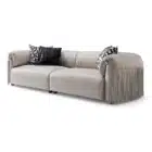 Malvera Fringe sofa with fringe armrests and leather upholstery