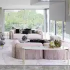 Malvera Fringe sofa with fringe armrests and leather upholstery