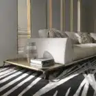 Serpenta Sculptural sofa with bronze textured metal base