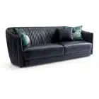 Sharpeia Pleated sofa in black leather with gold nailhead trim